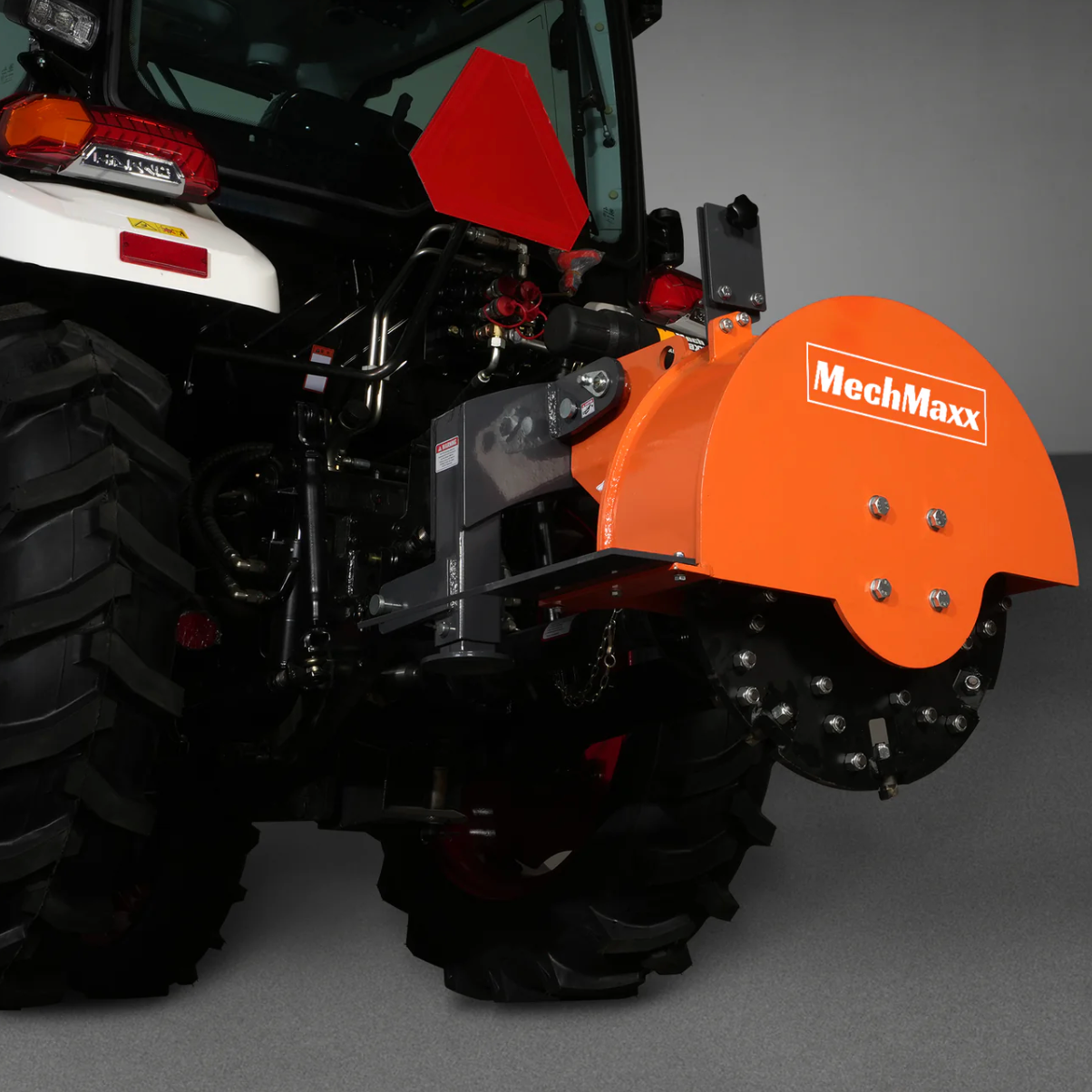 SG24 stump grinder working behind a tractor